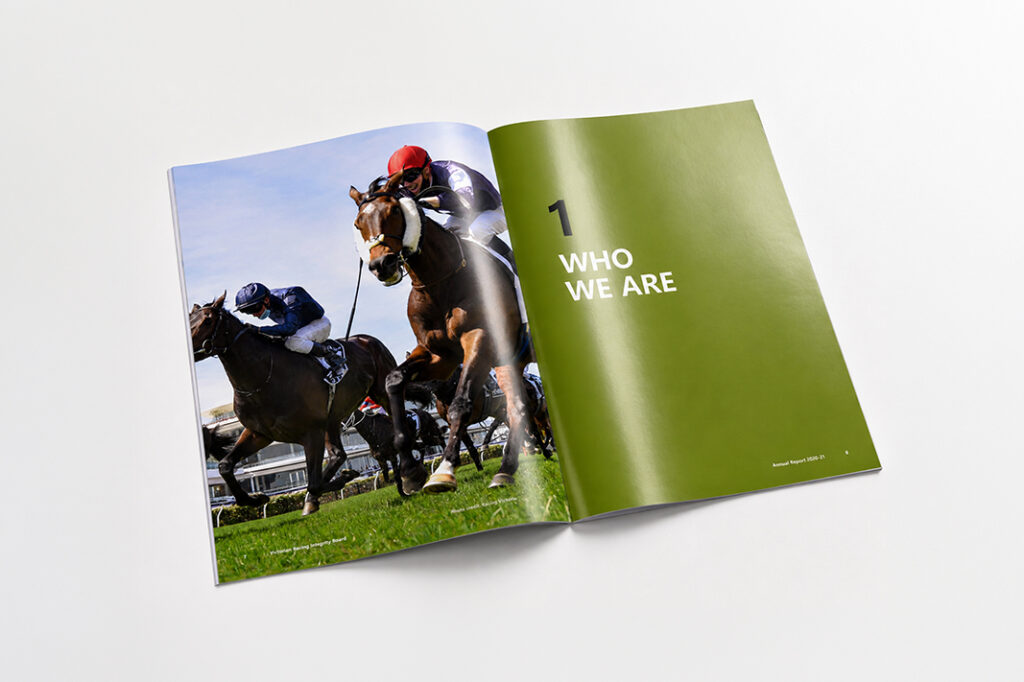 Open annual report page featuring a horse race image and the heading "1 WHO WE ARE" on a green background.